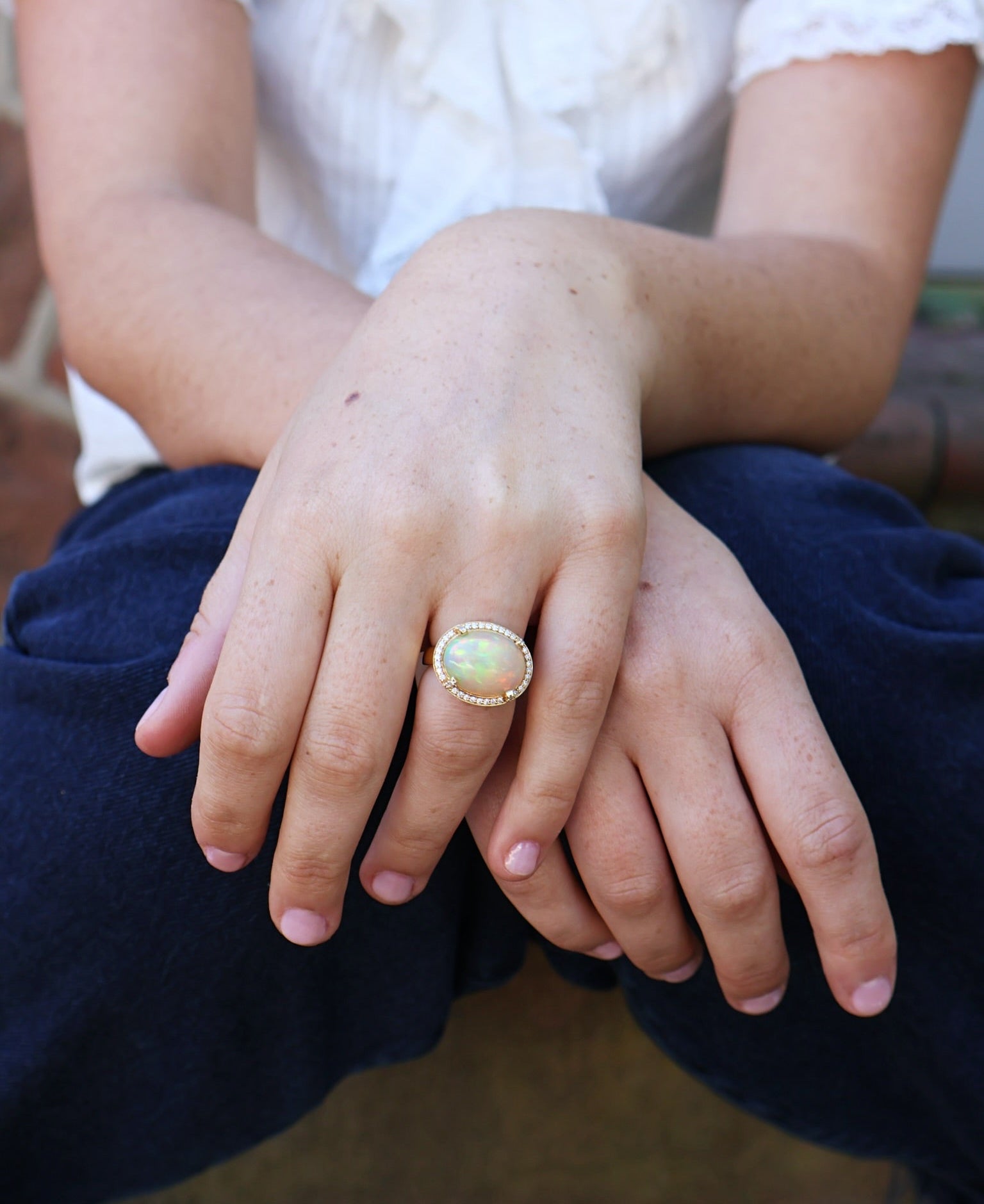 yellow gold diamond pave halo oval opal ring tiny gods goshwara