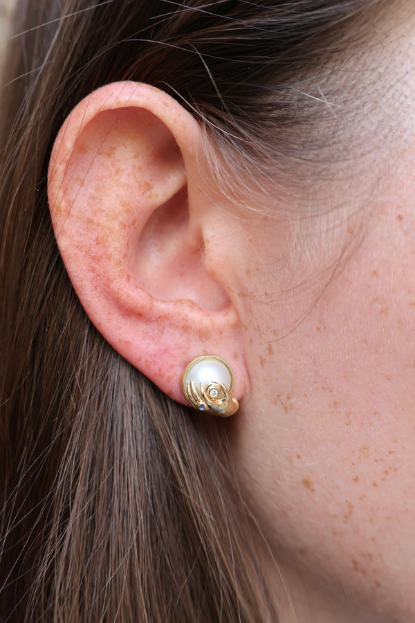 18k yellow gold pearl boob in hands Venus earring stud by Sauer Tiny Gods