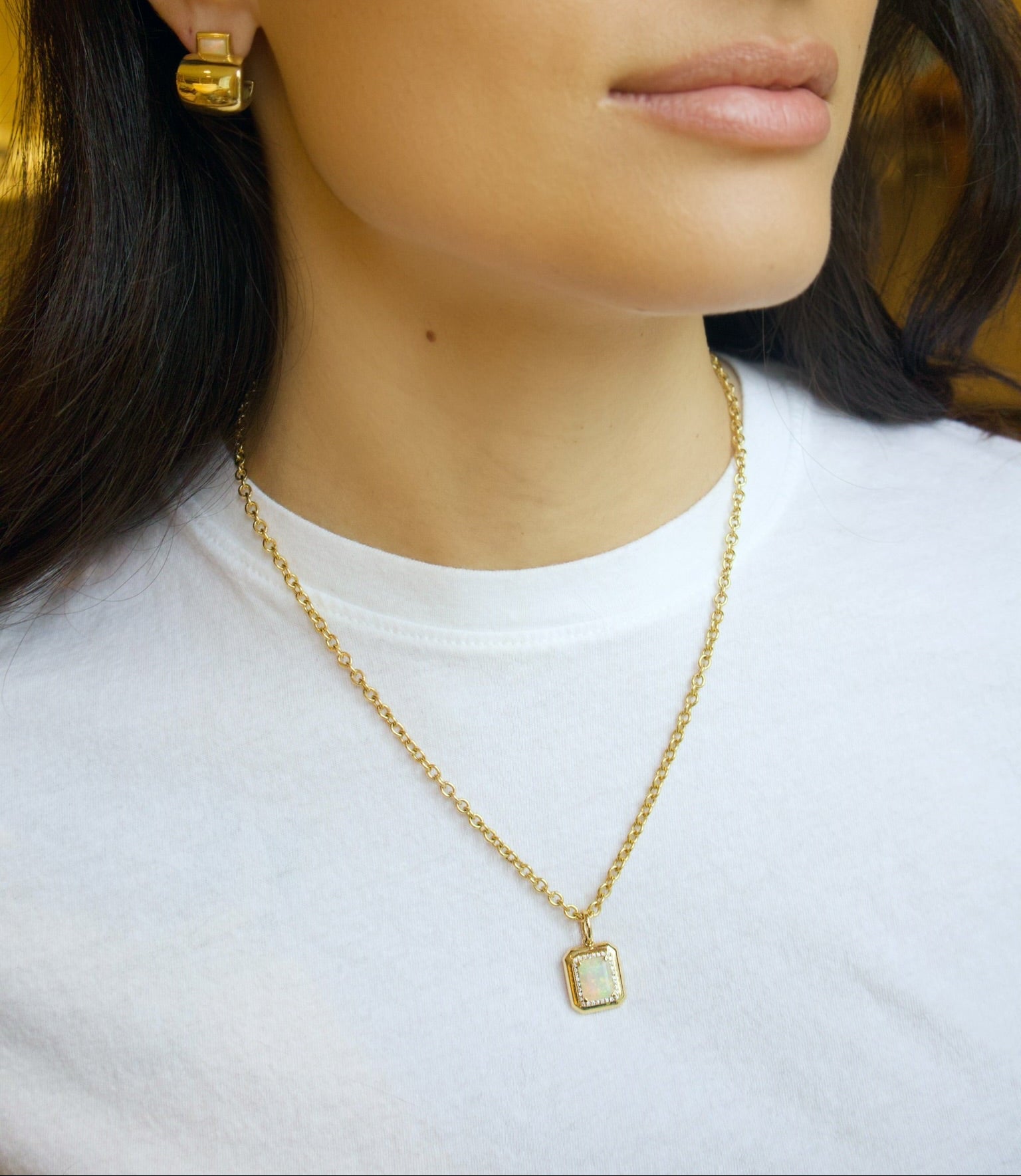 18k yellow gold emerald cut opal pendant with diamond border by Goshwara Tiny Gods 