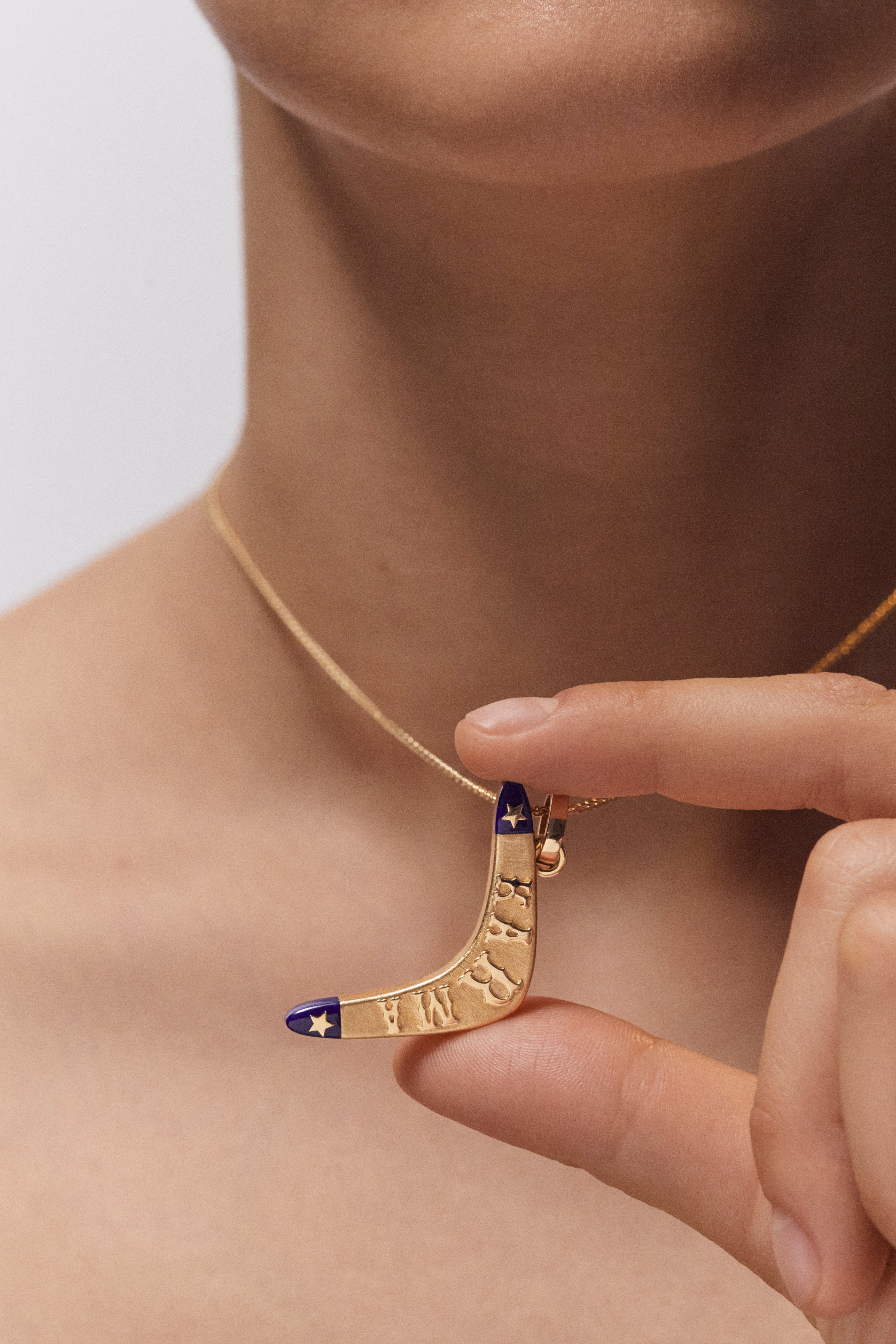 18k yellow gold and lapis karma boomerang pendant charm by Marie Lichtenberg Tiny Gods