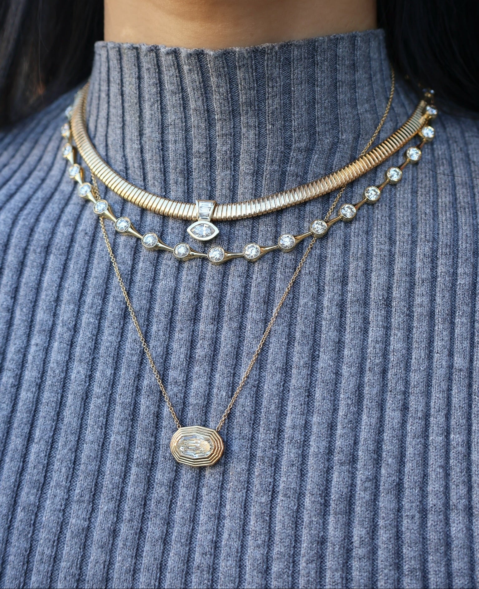 18k yellow gold modified GIA certified oval cut diamond bezel set in a ridged bezel setting on a fine link chain Tiny Gods 