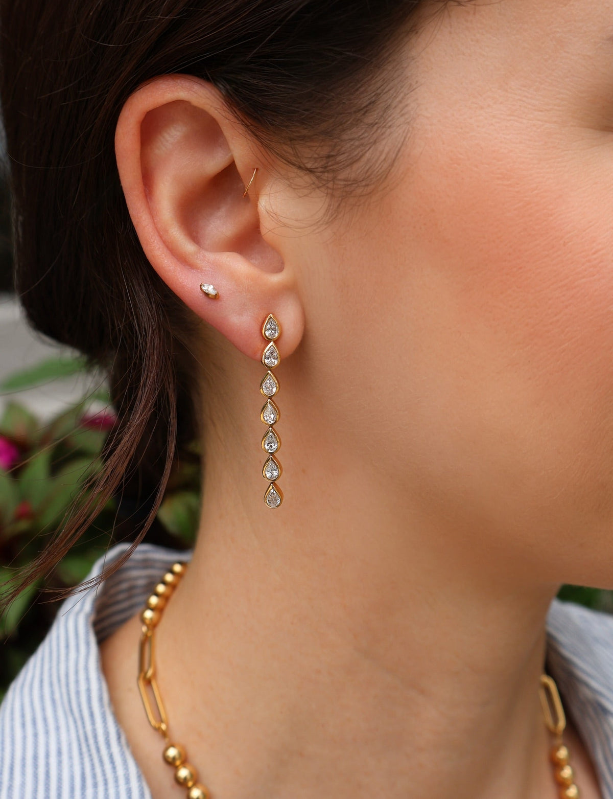 18k yellow gold bezel pear drop diamond earrings by Tiny Gods