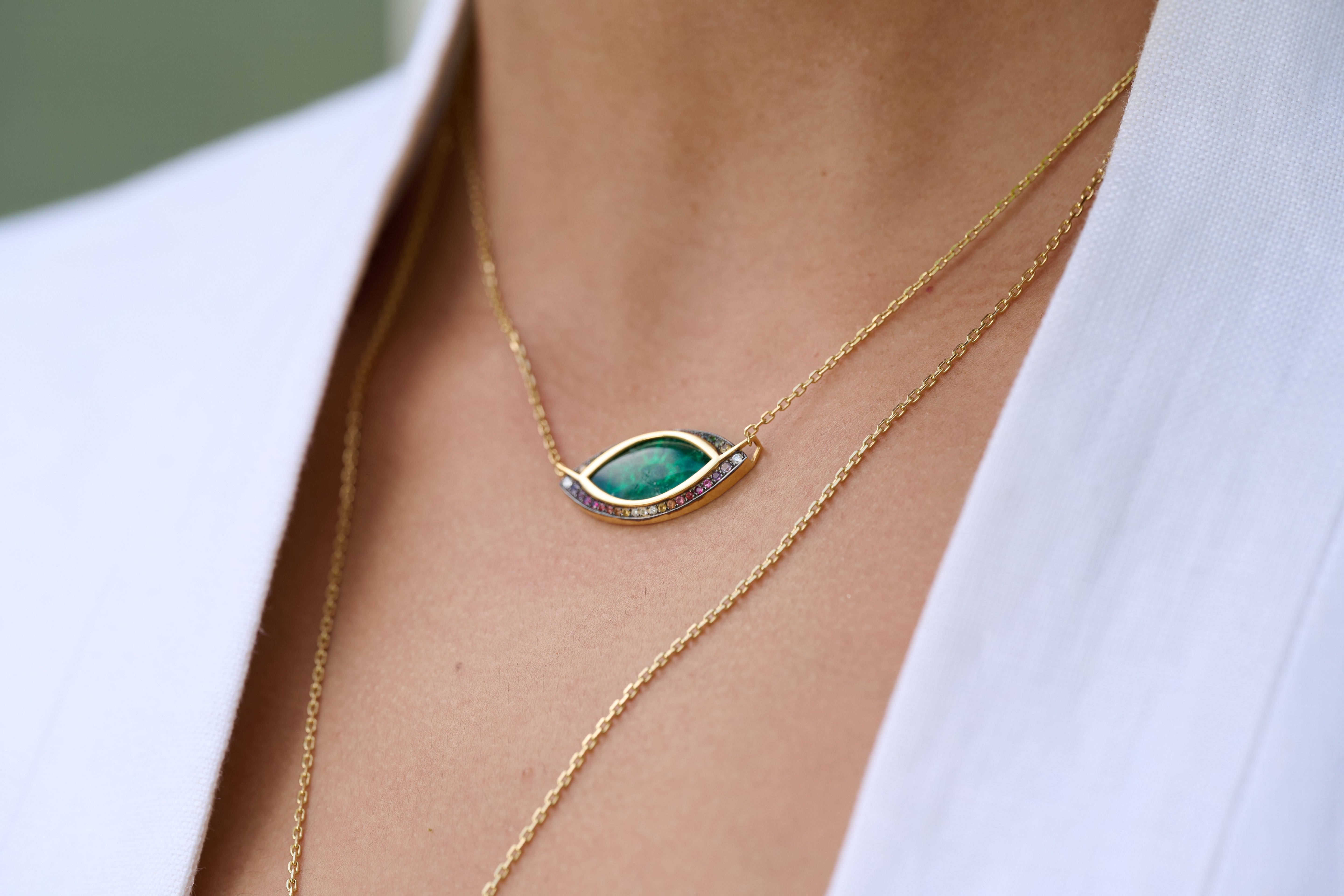 18k yellow gold marquise cut Muzo emerald pendant with rainbow gemstone border pendant necklace by Venyx Tiny Gods 