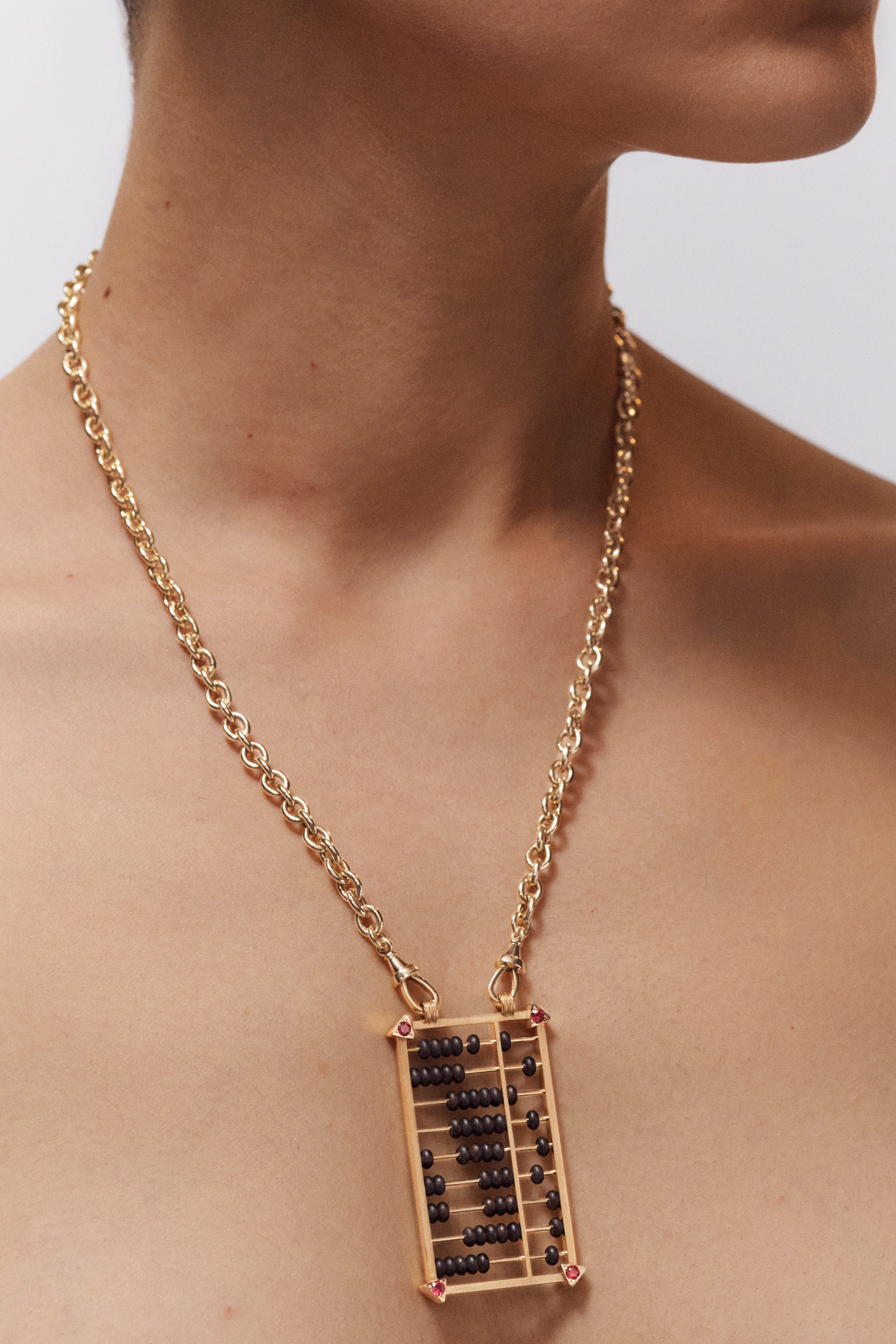 18k yellow gold and ruby black ebony abacus pendant necklace on a rosa classic chain by Marie Lichtenberg Tiny Gods 