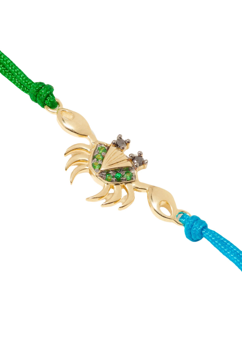 Yvonne Léon tsavorite green crab charm bracelet on blue and green cord Tiny gods