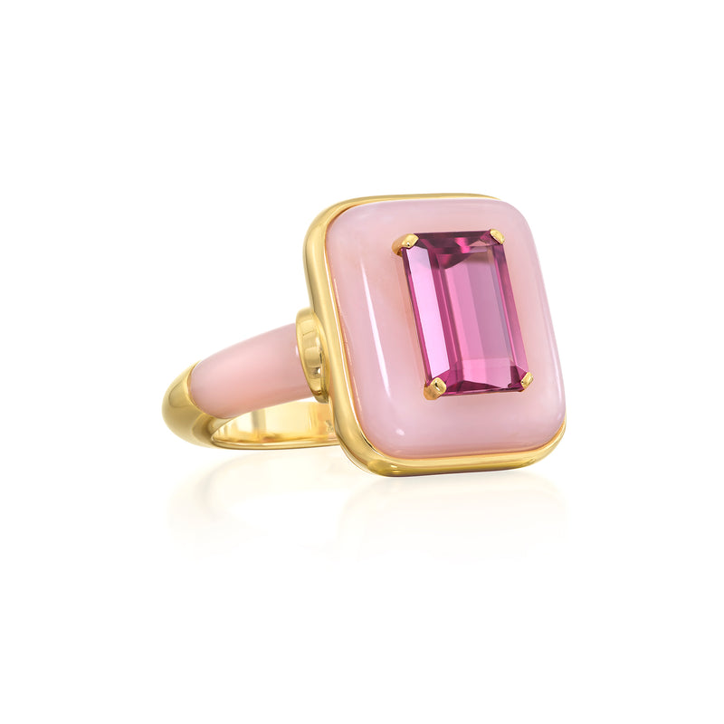 Sauer 18k yellow gold ring with cabochon pink opal with an emerald cut rubellite center stone. Pink opal is also inset on the front of the band. 