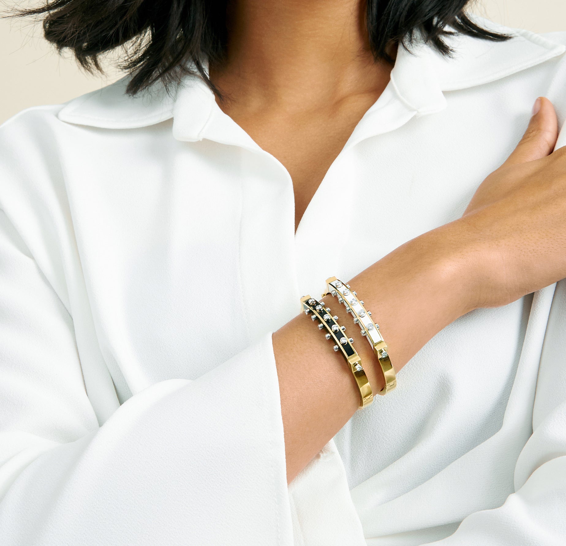 18k yellow gold Studlette bangle with collet set brilliant cut diamonds with white and black enamel by David Webb Tiny Gods