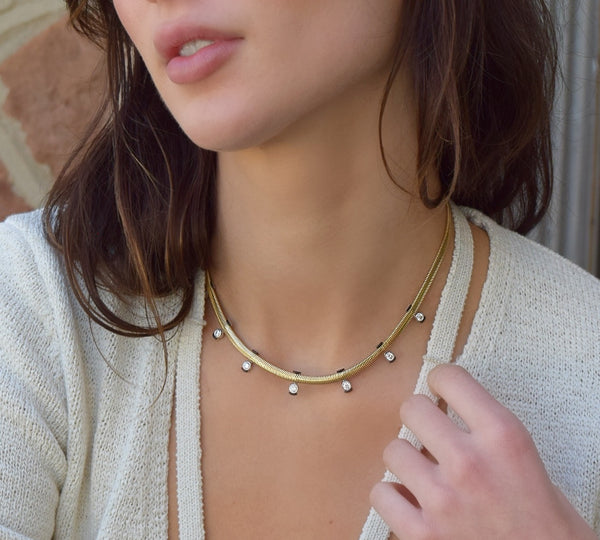 Feelings Necklace with Round Diamonds 18k white and yellow gold with black enamel by Nikos Koulis made in Greece snake chain at Tiny Gods on model