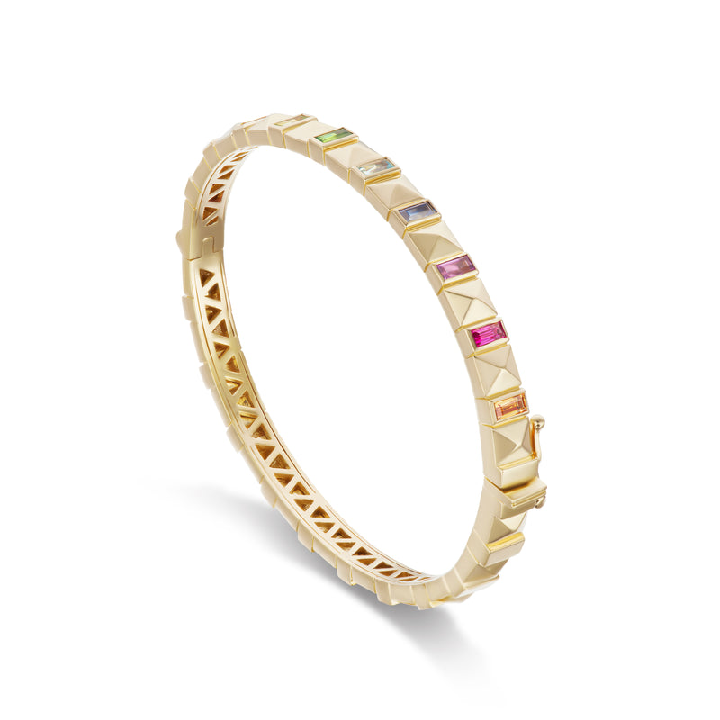 Harwell Godfrey 18k yellow gold bangle with baguette multi-colored sapphires. Double latch closure and hinge bracelet. 