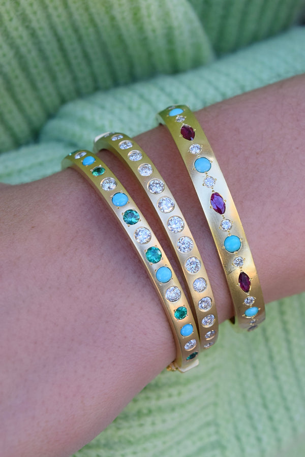 18k yellow gold gypsy bangle bracelet with turquoise, marquis ruby and white diamonds by Jenna Blake Tiny Gods on model