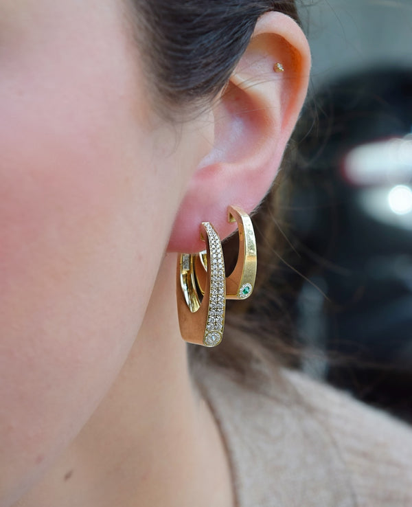 14K yellow gold Nano Grace emerald and diamond hoop earrings by Rainbow K at tiny gods on model