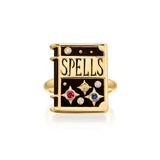 Sauer 18k yellow gold spells ring shaped in a book with onyx and blue and pink sapphire, citrine and diamonds. 