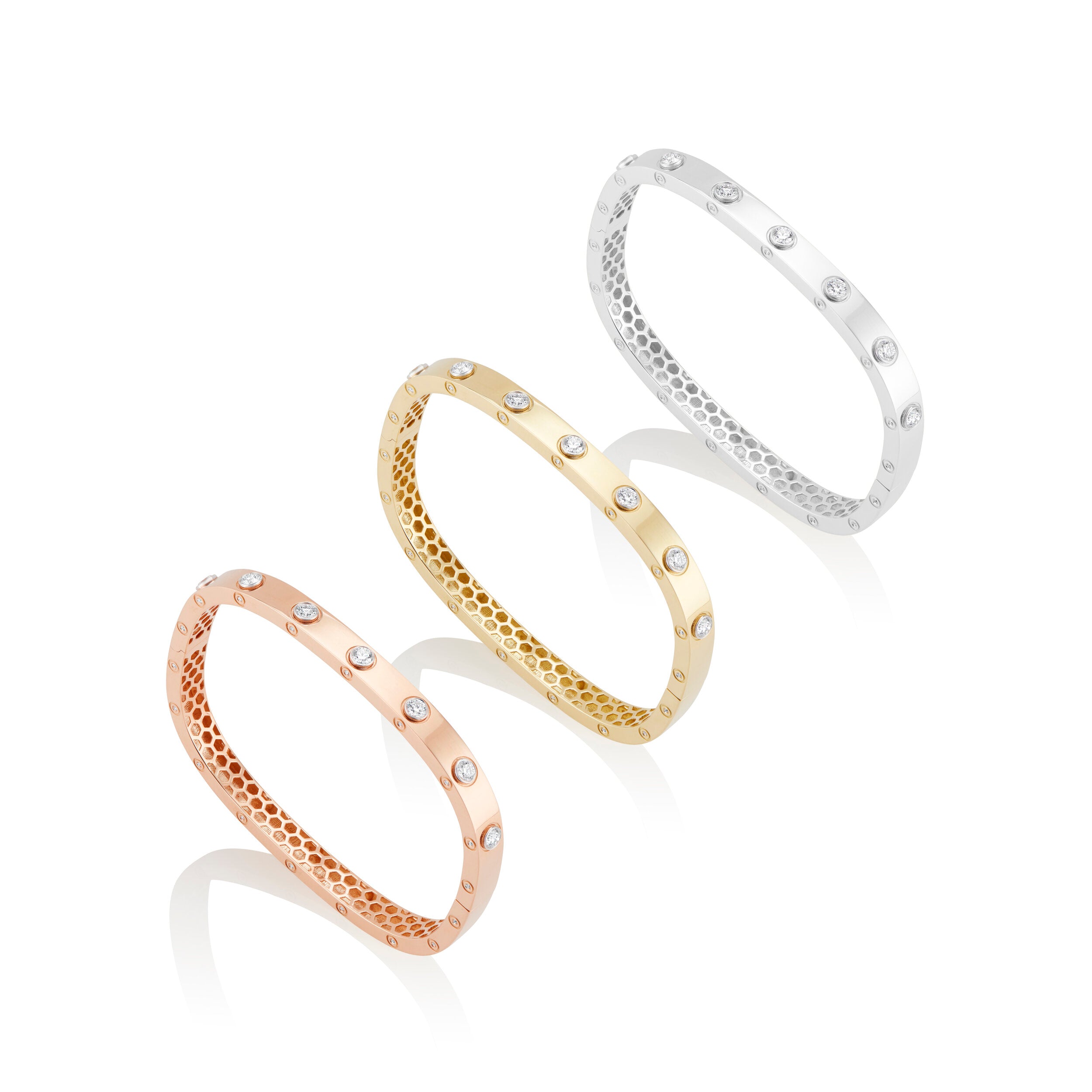 18k gold bangle with bezel set diamonds by Tiny Gods