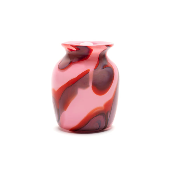 pink vase with red and black swirls hand blown by Paul Arnhold Tiny Gods